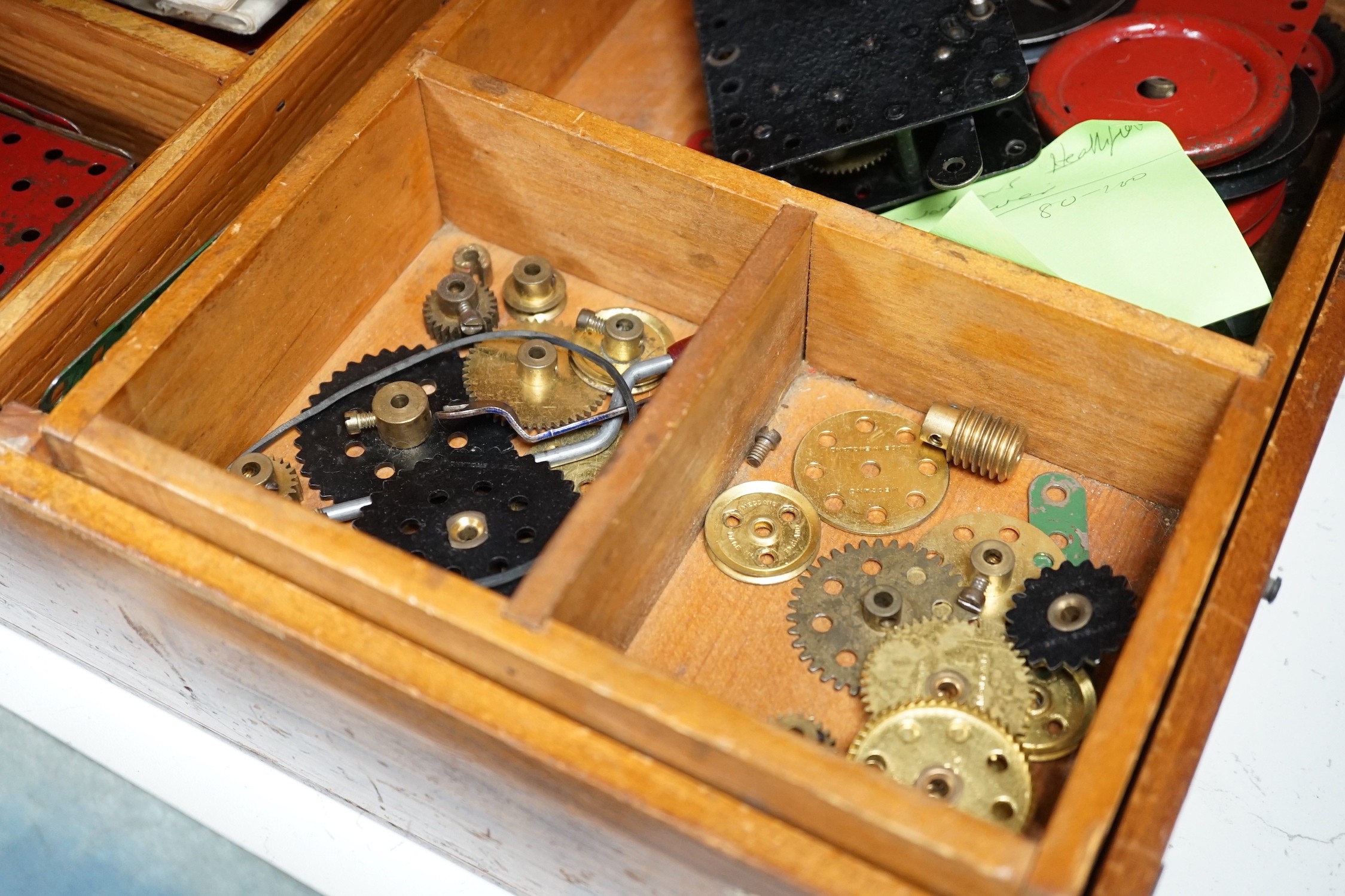 A wooden boxed meccano set and two boxed E20R electric motors